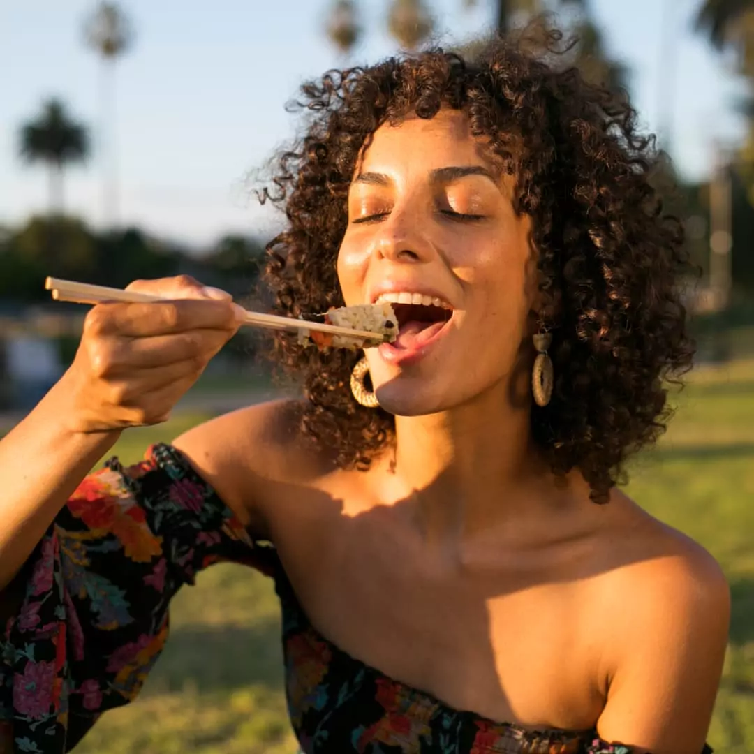 A woman eating sushi
